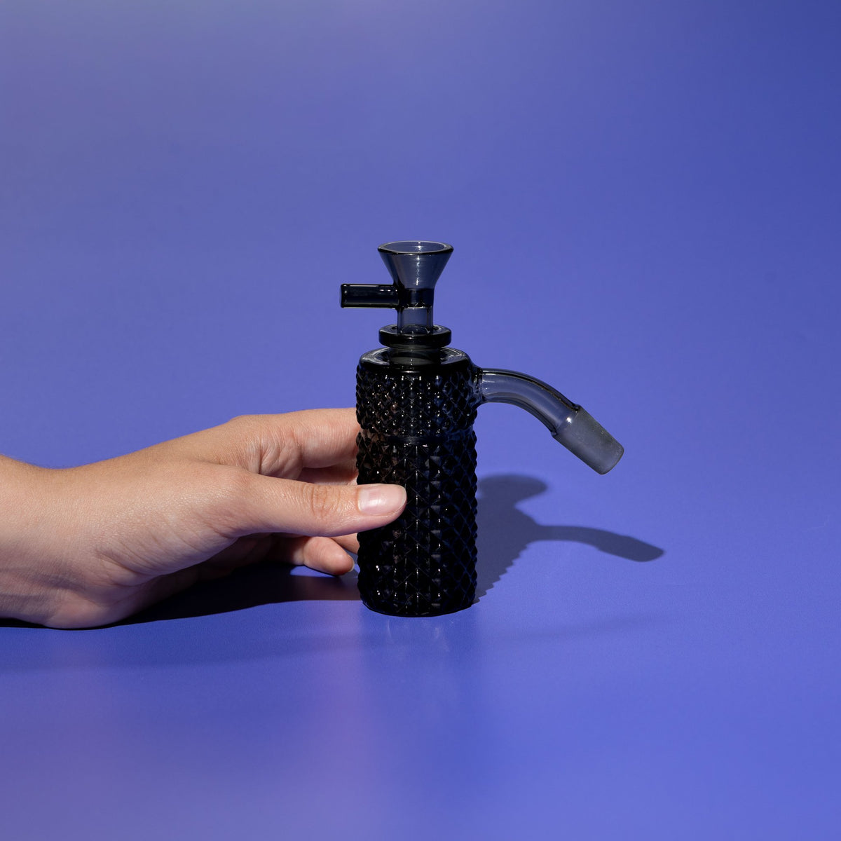 Jane West x Prism Midnight Smoke 14mm 45 degree textured glass ash catcher held in hand