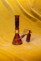Switch Jane West x Prism Amber 14mm 90 degree ash catcher attached to a glass water pipe 2 image