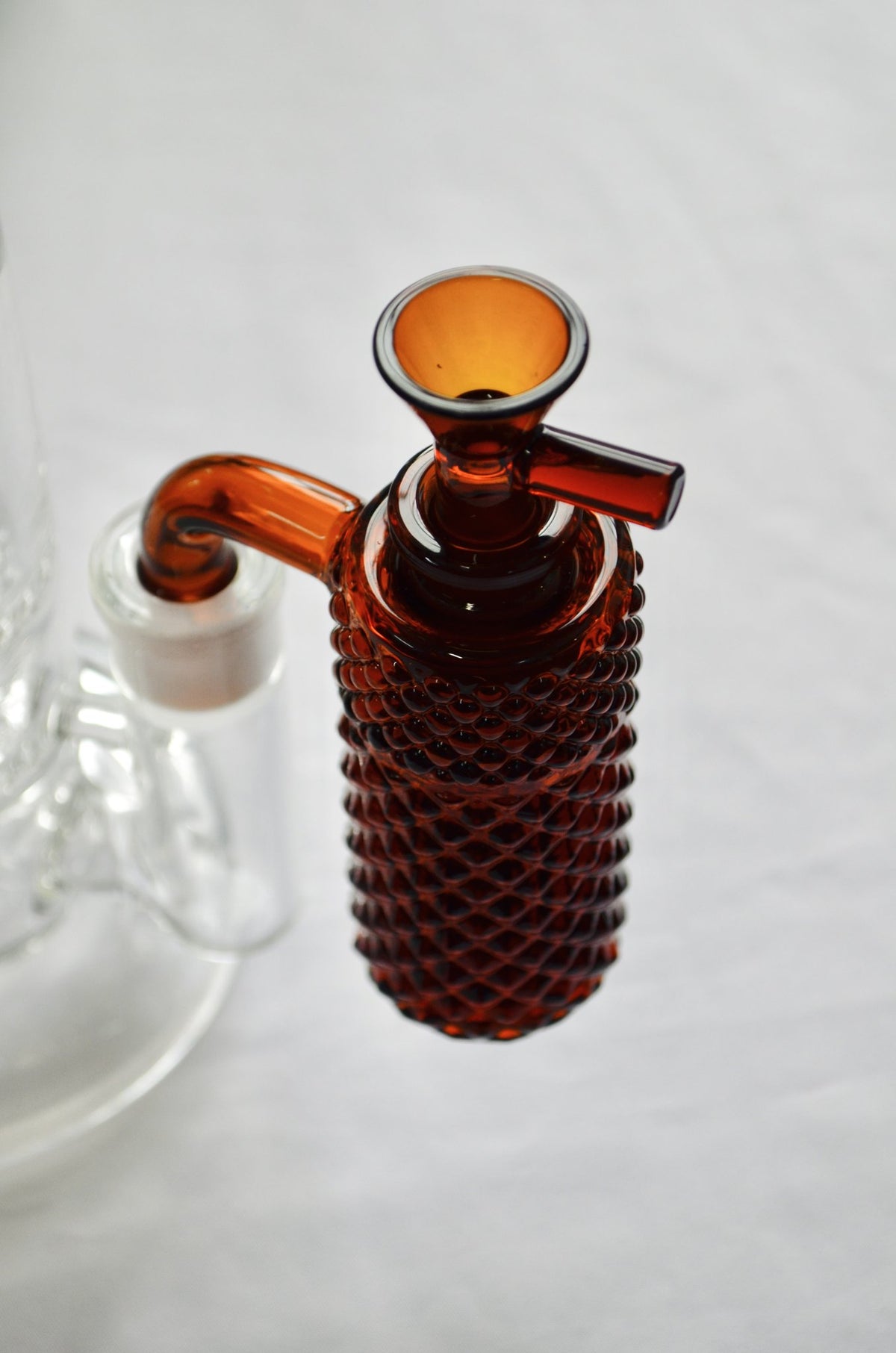 Jane West x Prism Amber 14mm 90 degree textured glass ash catcher, lifestyle photo