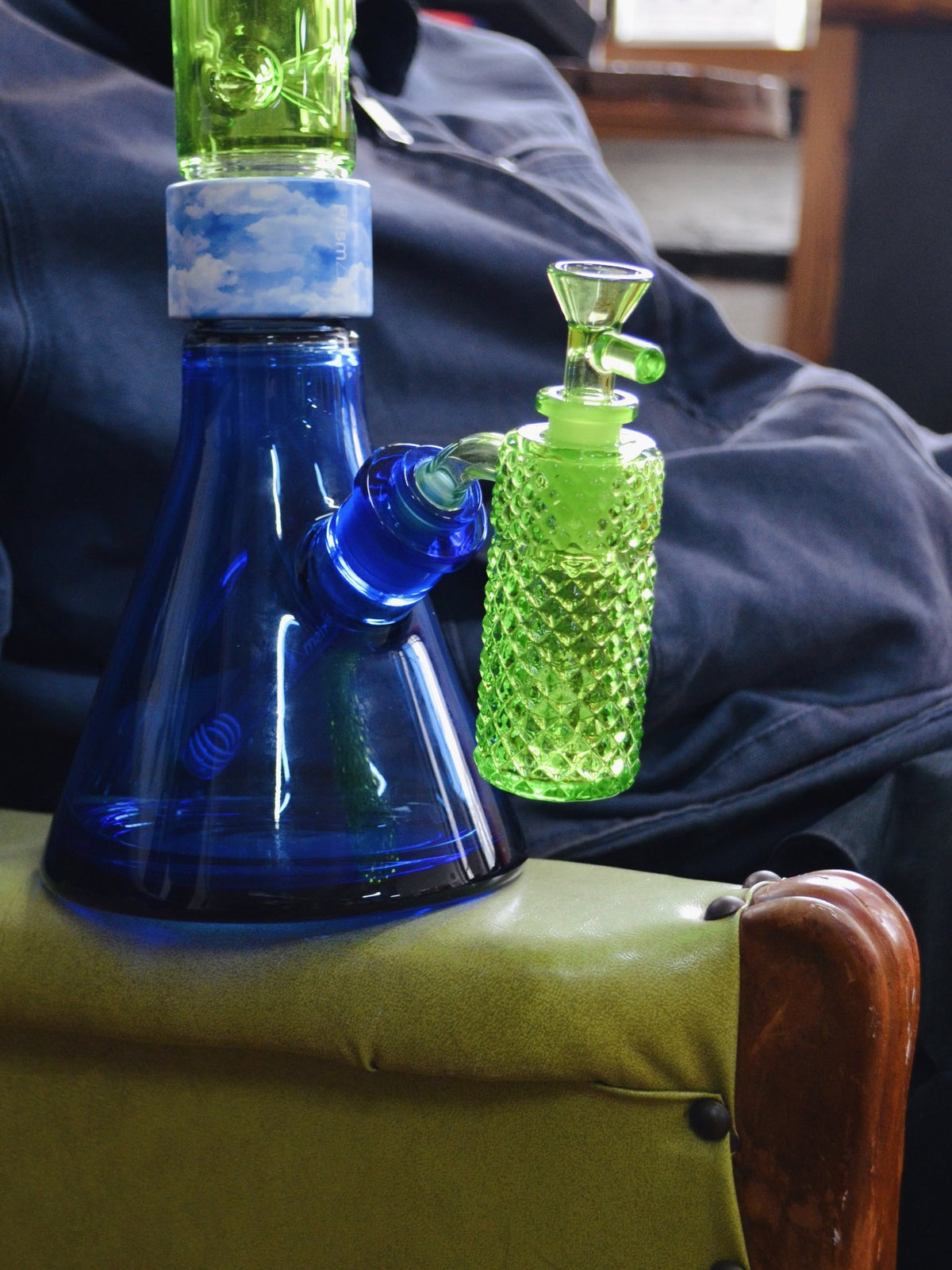Jane West x Prism Slime 14mm 90 degree ash catcher attached to a blue beaker bong