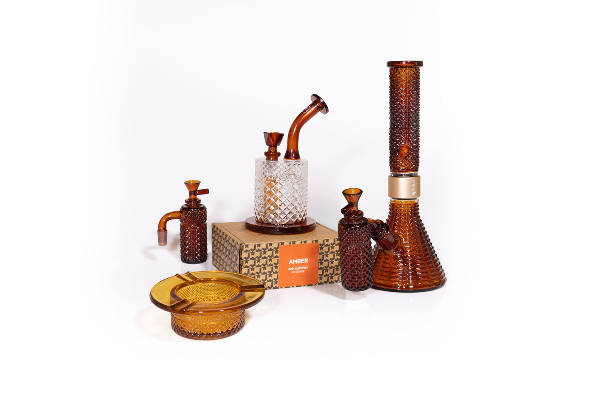 Jane West Twenties Collection Amber set: water pipe, 90 degree ash catcher, Prism modular water pipe with ash catcher, and Amber ashtray